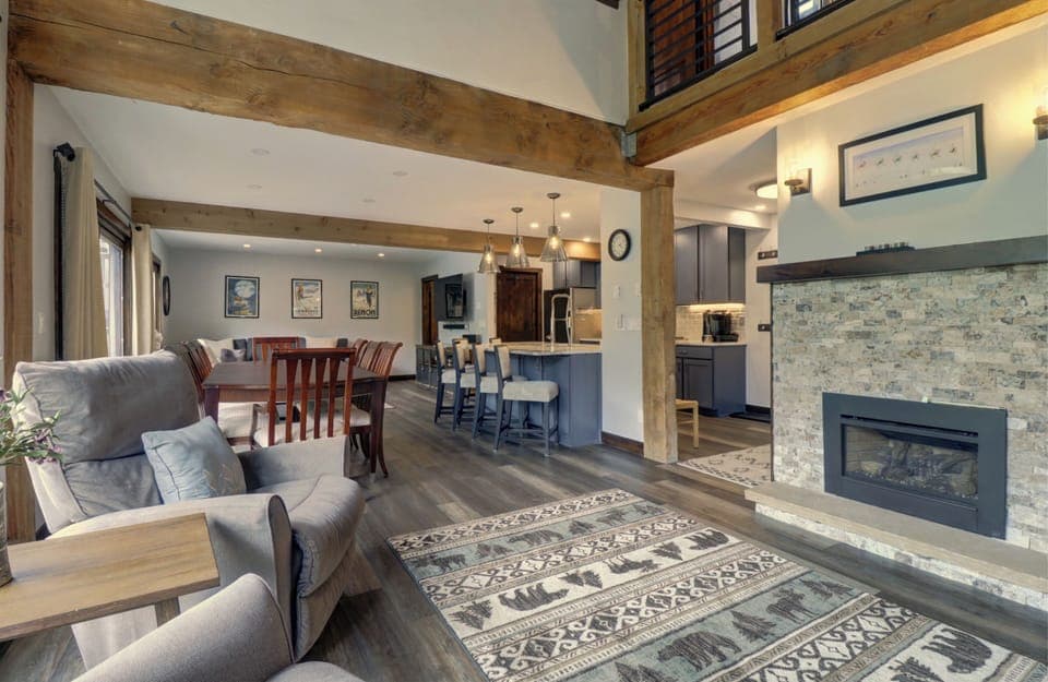 Living room features a cozy fireplace area
