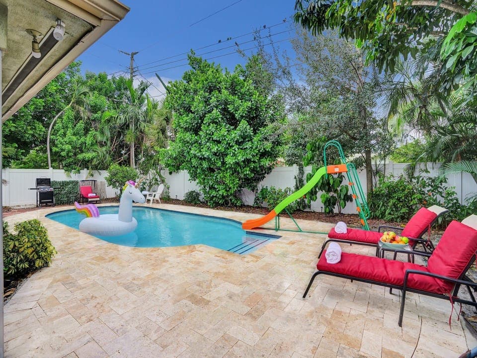It is time to soak up the Florida sun in this private, family friendly yard complete with a pool, trampoline, lounge chairs, & a grill!