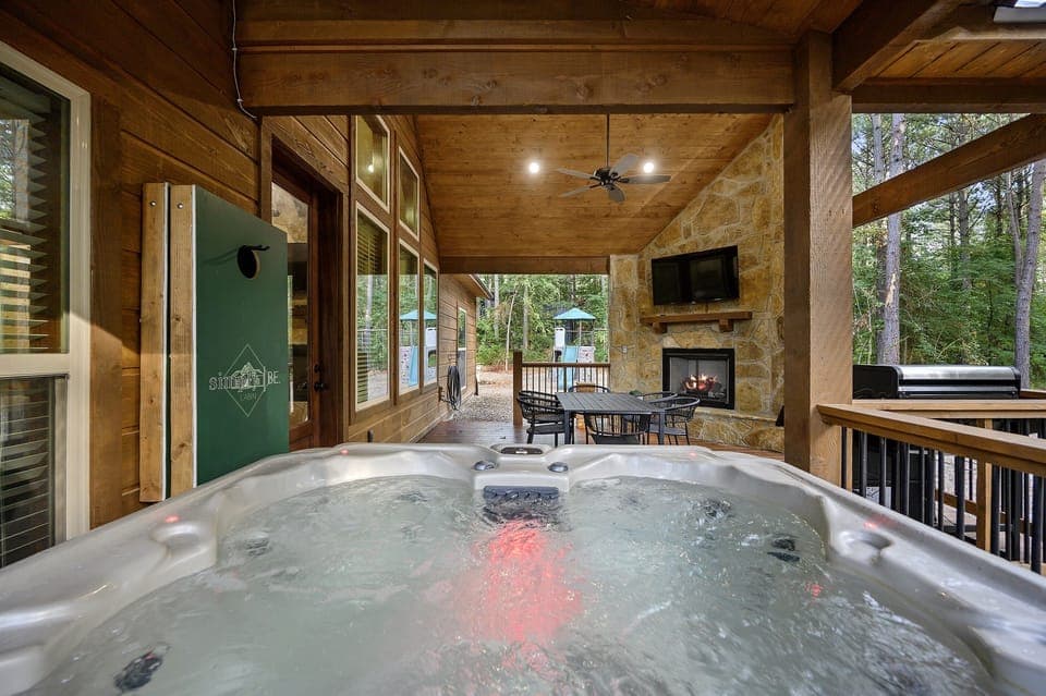 Fabulous patio with games, jacuzzi, fire place (indoor and outdoor fireplaces are seasonal and operable from beginning of October to mid May), bbq, TV and a beautiful view. Play yard for the kiddos.