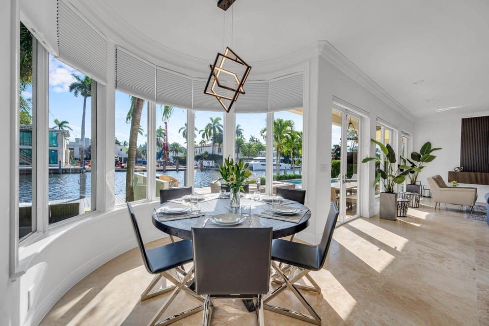 Breakfast nook looking out to the backyard and dock.