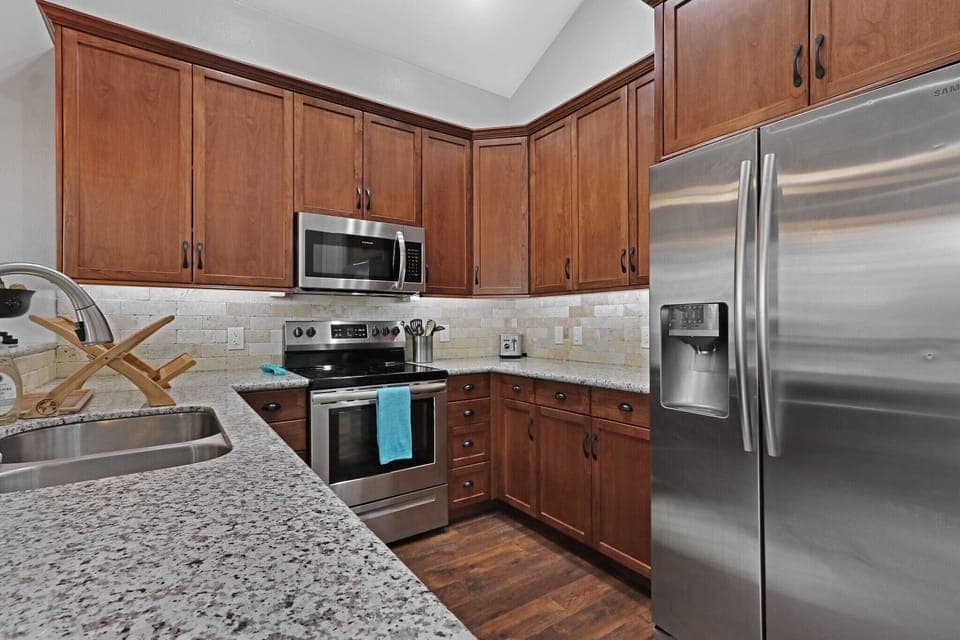The kitchen features all stainless steal appliances