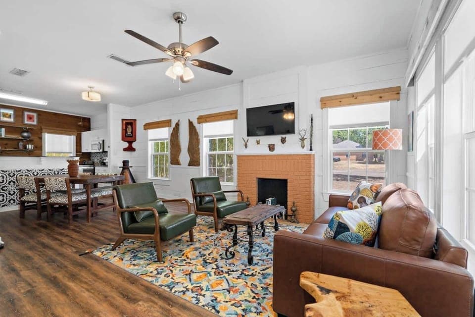 Living room and kitchen open room concept adjacent to the dining area and kitchen of the main house.