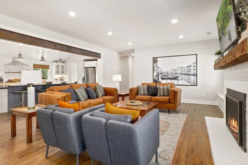 In the living room you'll find a leather couch, a leather loveseat and two lounge chairs. Settle in for a movie on our 65-inch Samsung Smart TV or curl up with a book in front of our working gas fireplace!