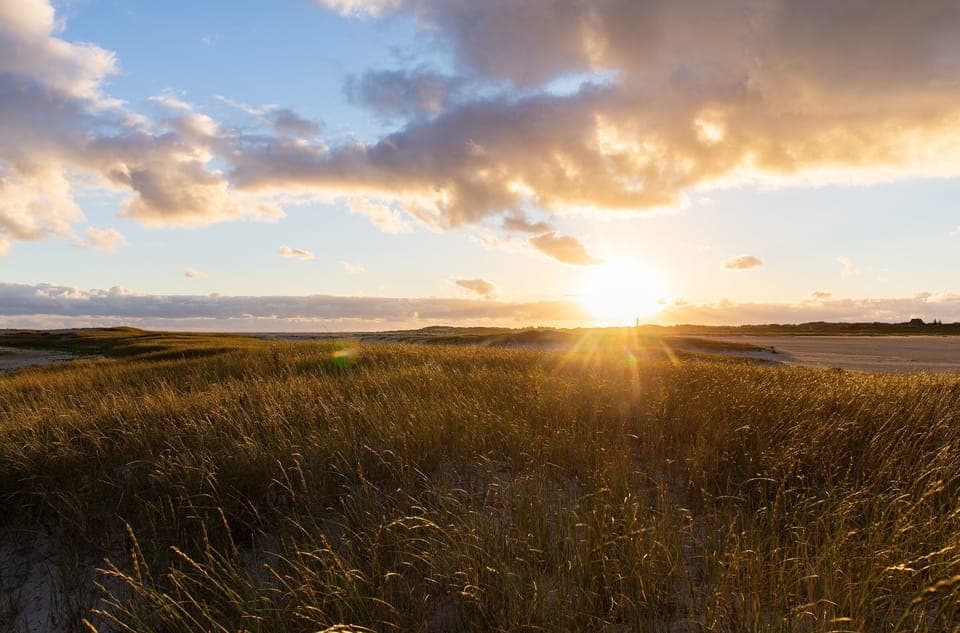 Sunset on the beach with view to Wittduen on the island Amrum