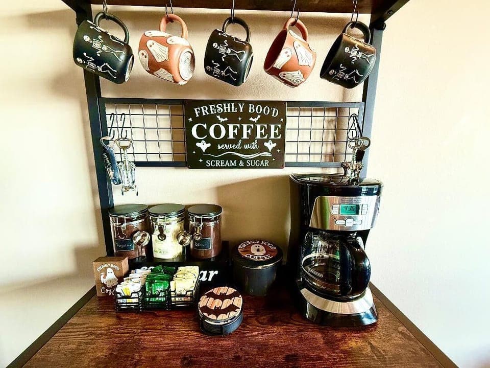 Coffee Bar
Start your day with freshly “boo’d” coffee. Halloween mugs, treats, and décor make every cup feel like a seasonal celebration.