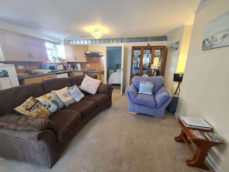 Comfy sitting room with kitchenette. 