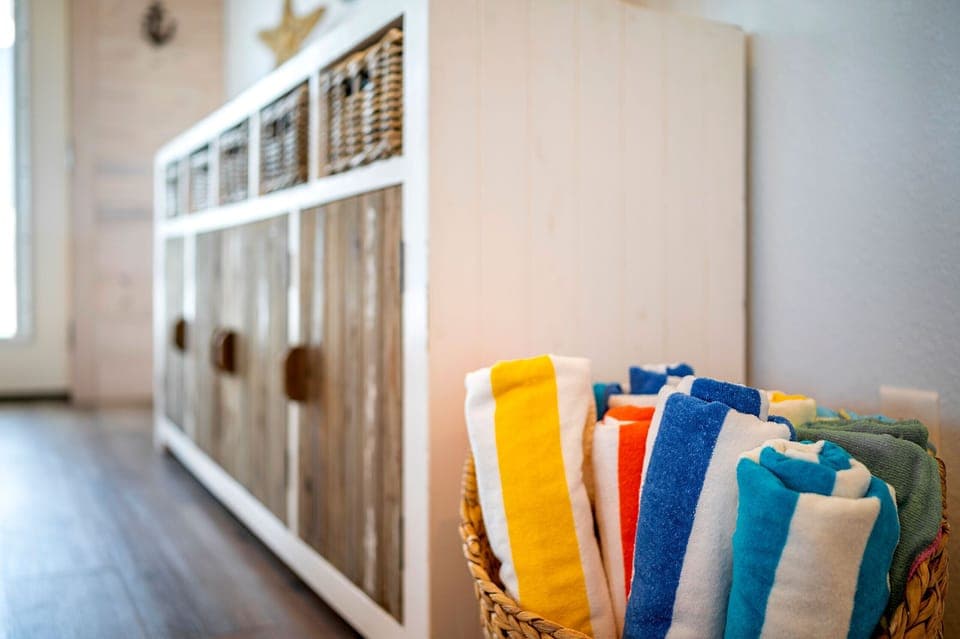 Hot Tub Towels provided for you in the living room :) 