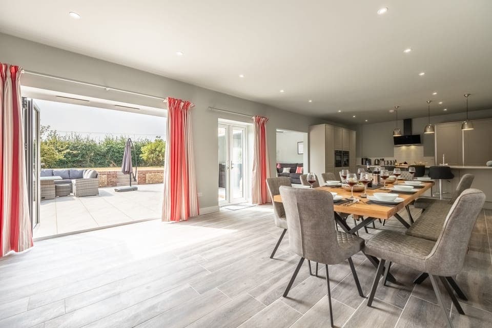 Appletrees, Burnham Market: Step out to the sunny patio from the dining room