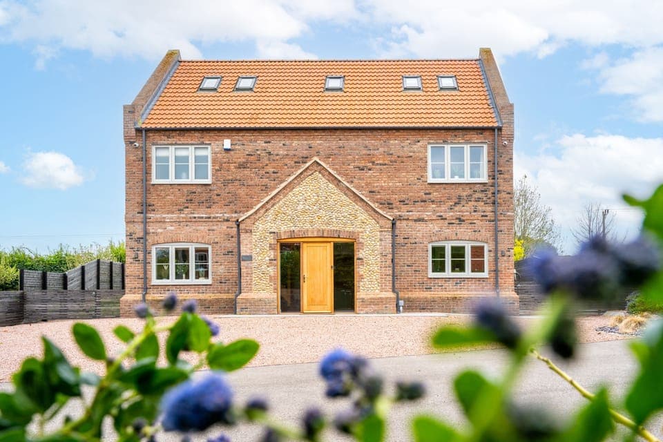Hedgerows, Burnham Market: Front elevation of Hedgerows with plenty of parking
