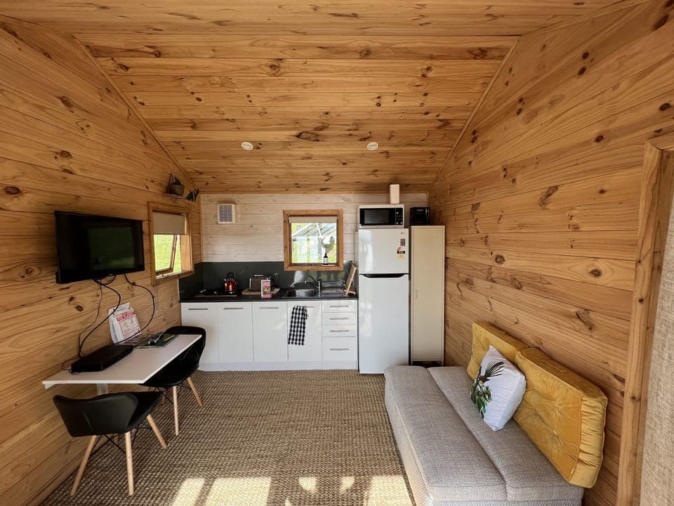 Kitchenette with full fridge and 2 burner gas hob.