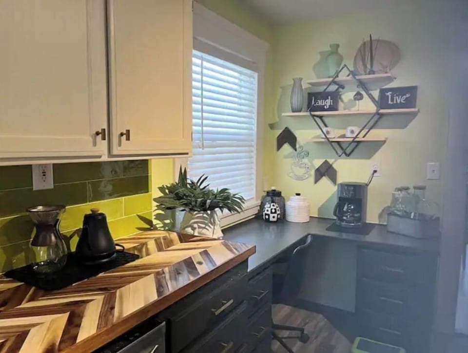 Desk area and fully stocked coffee bar. Drip and pour over pots.