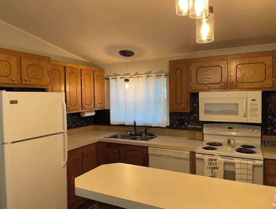 Kitchen with updated appliances. Fully furnished with dishes, pots/pans, blender
