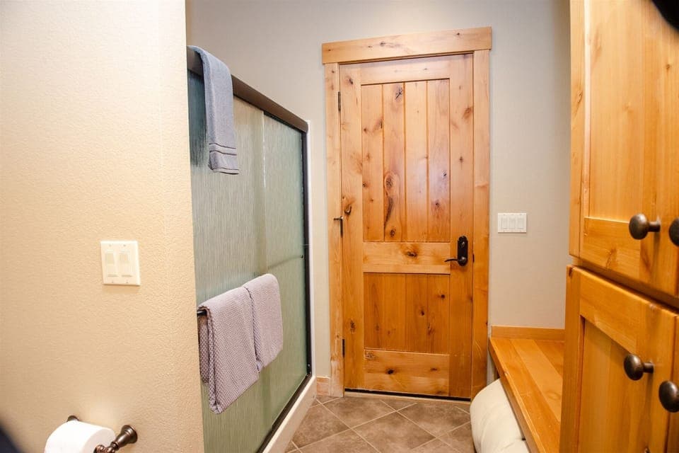 This hall bath is attached to one of the downstairs bedrooms and the back patio