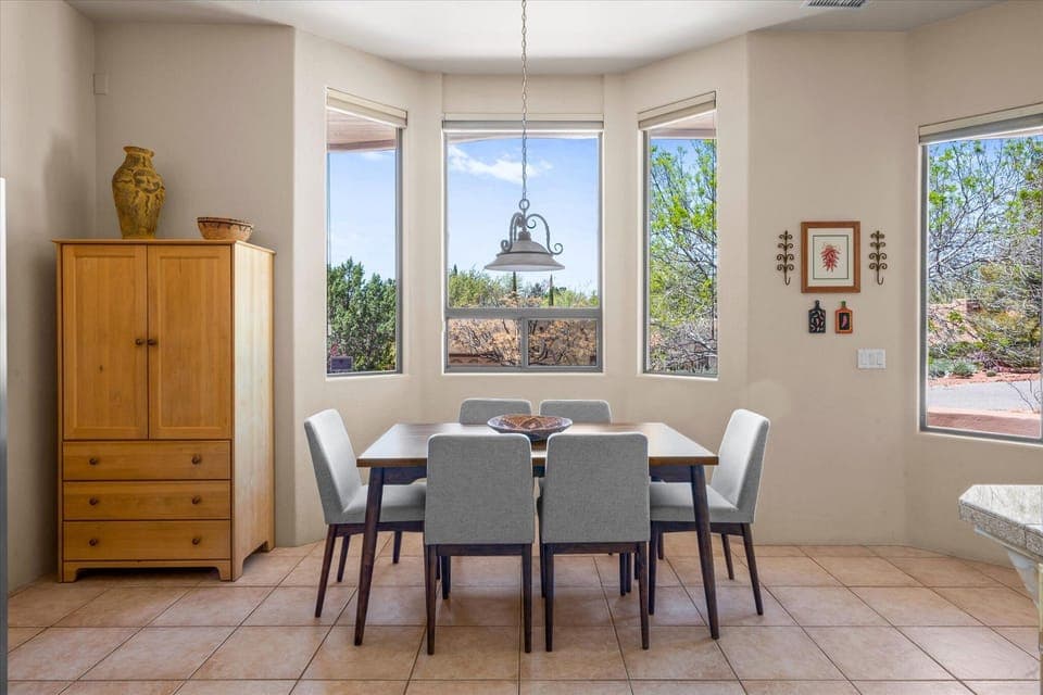 Dine in style and take in the natural beauty with this stunning dining space.
