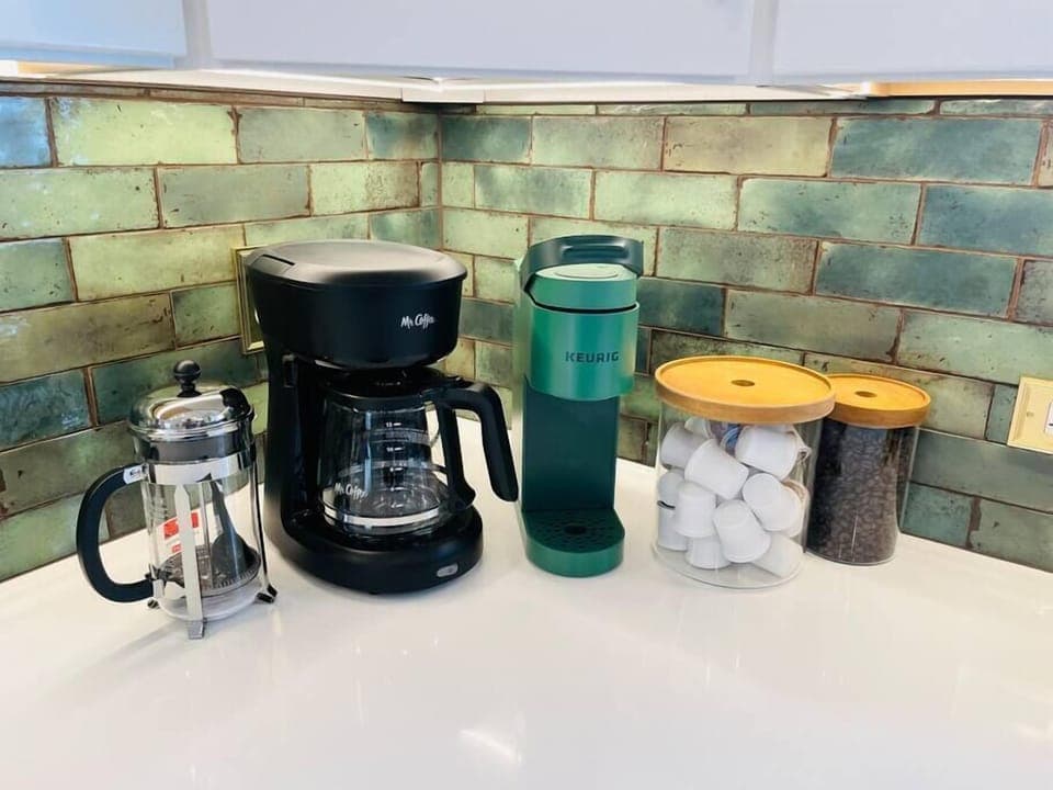 Start your mornings right with coffee three ways—French press, drip, or Keurig—fully stocked with all the fixings to fuel your day. ☕💛