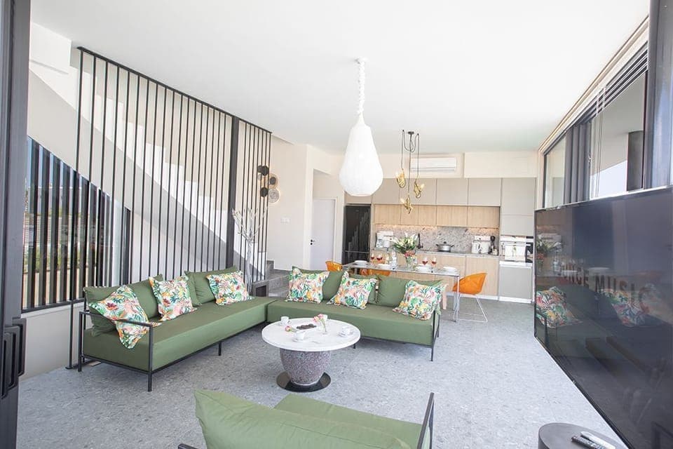 Living room with sofas, coffee table and Smart TV