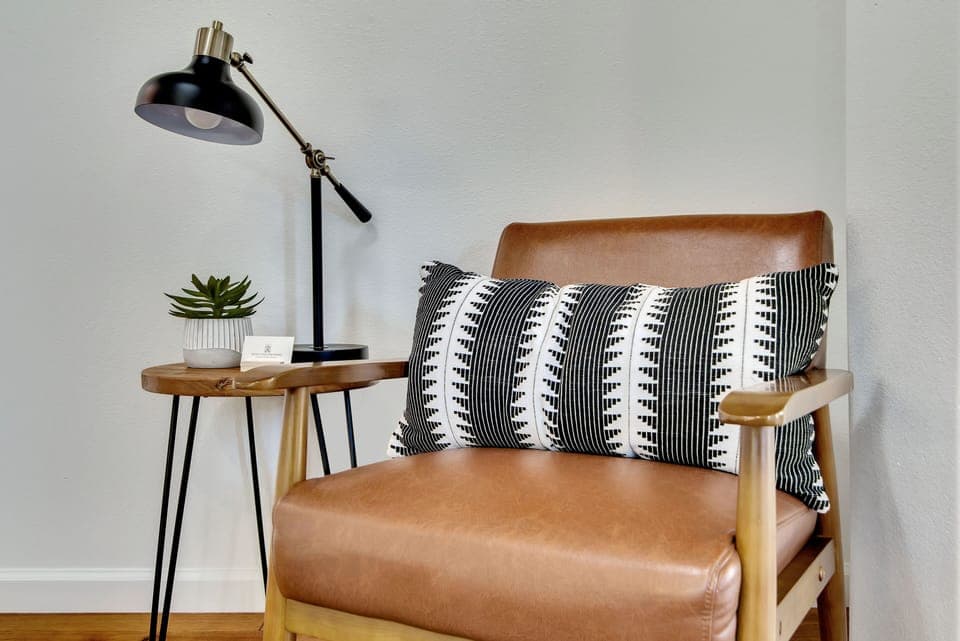 Reading nook with a plush chair and reading light
