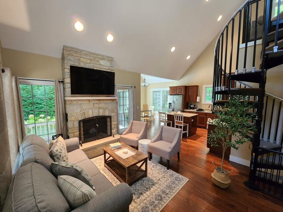 Wood burning fireplace, vaulted ceilings and an open concept floorplan. 