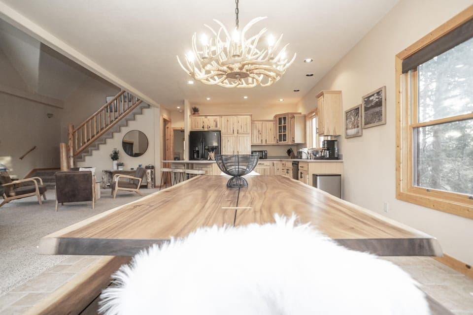 - Fun loft space featuring a shuffleboard game table   - TV setup perfect for entertainment and game nights   - Ideal hangout spot for families and friends together