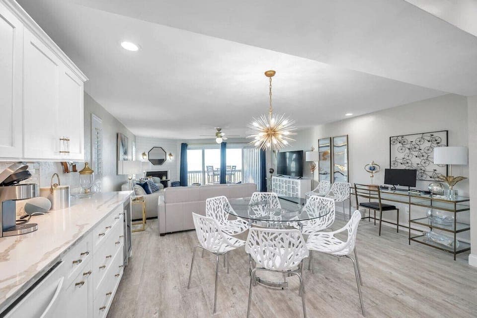 Airy kitchen & dining space w/ clean finishes and plenty of room to cook, dine, and connect.
