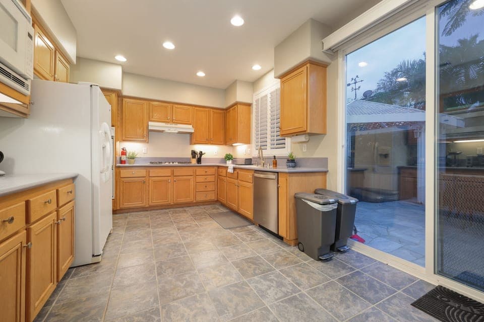 This fully-equipped kitchen has everything you need. You can see into the living room and dinning area while cooking.