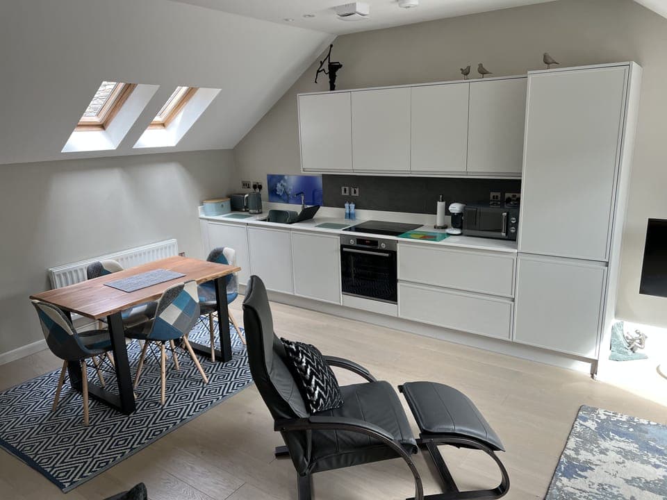 View from the living room to the dining/kitchen area.
