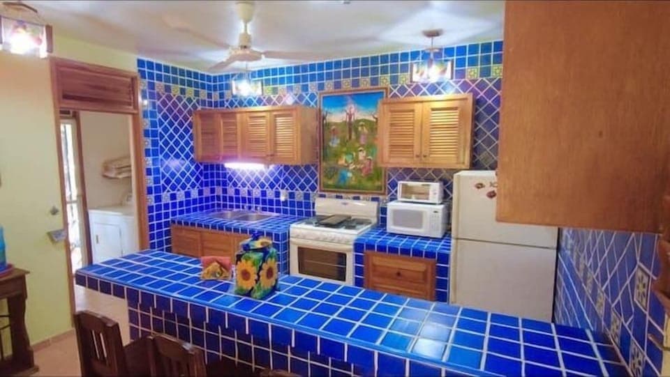 Open concept kitchen has plenty of room for everyone to help