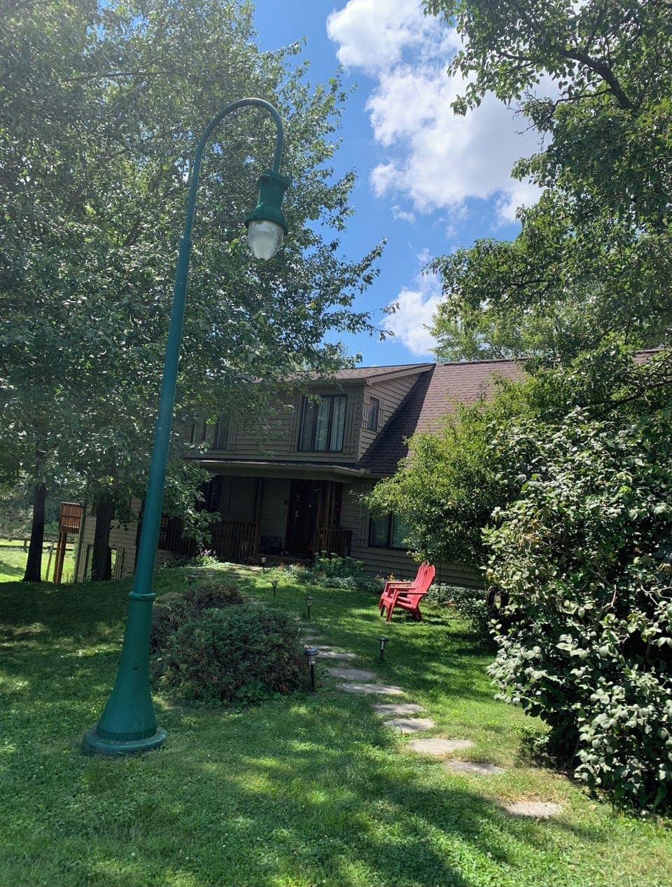 Front walk is lit at night with solar and electric lighting.