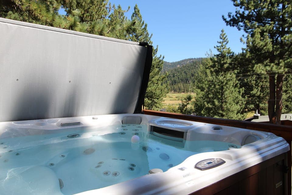Front Deck has hot tub, firepit, and mountain views.