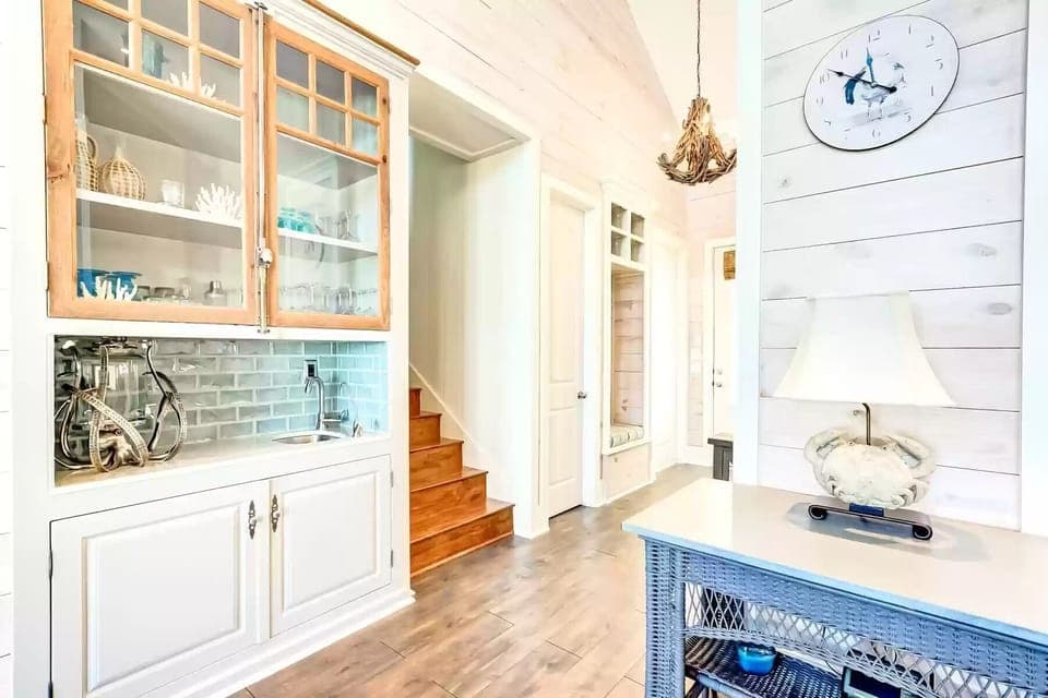 The wet bar; stairs next to it lead up to large bedroom