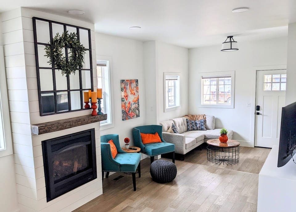 Entry to Living Room with smart TV and gas fireplace.