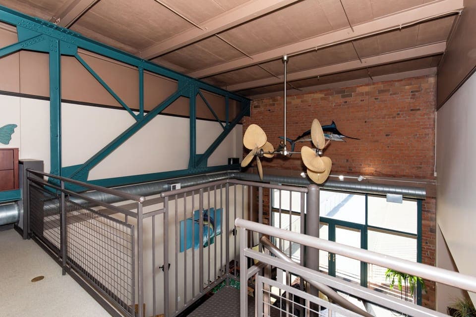 Step into this stunning industrial loft featuring exposed brick walls, soaring ceilings, and unique architectural details that create an unforgettable atmosphere.