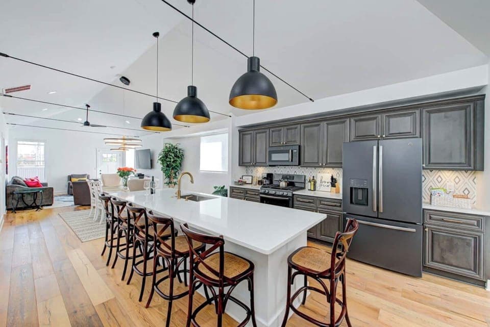 Vaulted ceiling spans the second-level living area for a wide-open feel with your group.