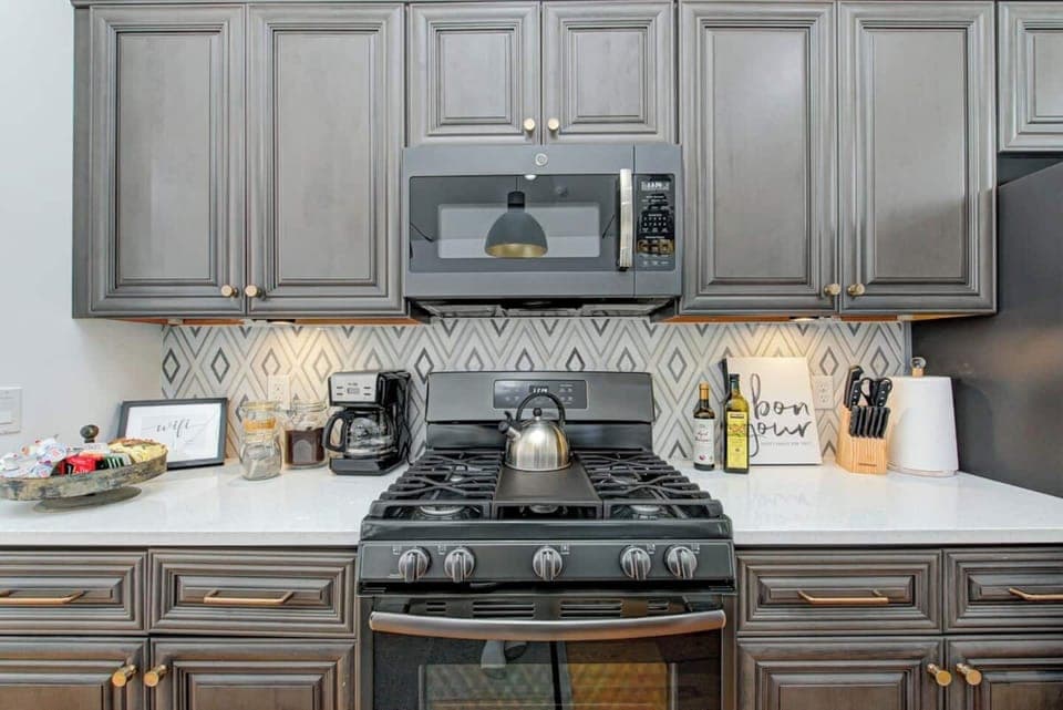 Use clean, new GE appliances to prepare meals for your group.  Large appliances include microwaves, oven range, French door refrigerator, dishwasher, & garbage disposal.  The upstairs kitchen has a gas oven range and the lower level has electric.