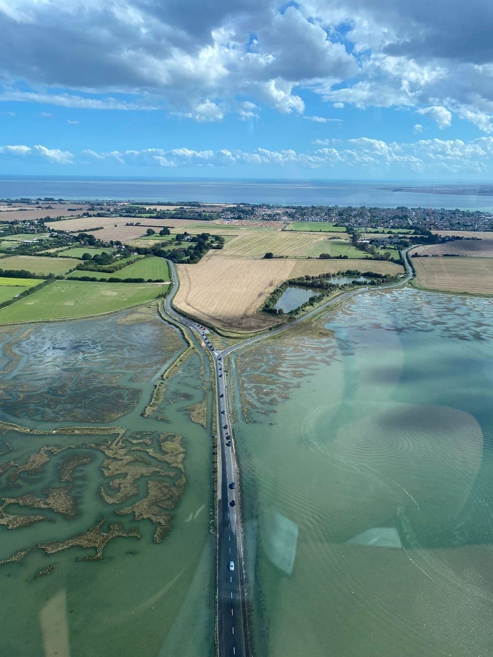 A great aerial shot of the ' Strood' -the road onto the Island and the open sea 