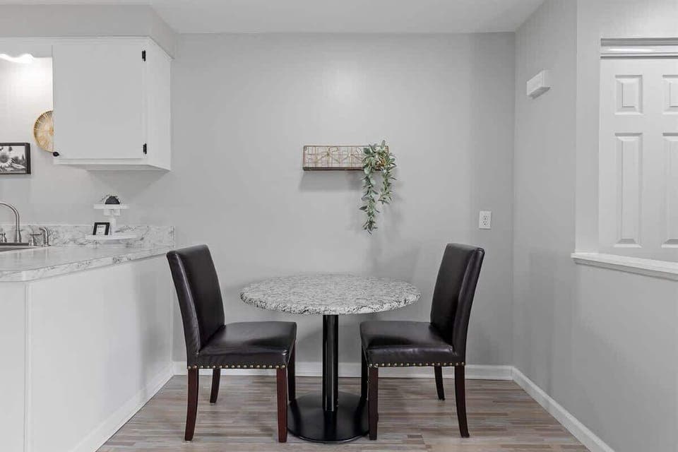 Gather with friends and family for a delicious meal in this cozy dining room.