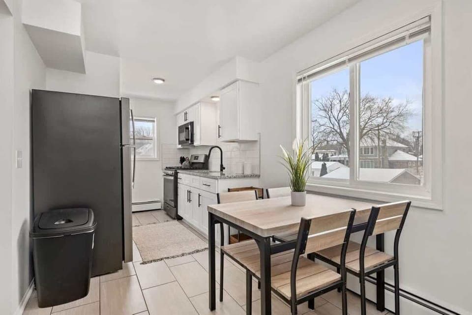 Kitchen opens up into the dining area, featuring tons of natural light