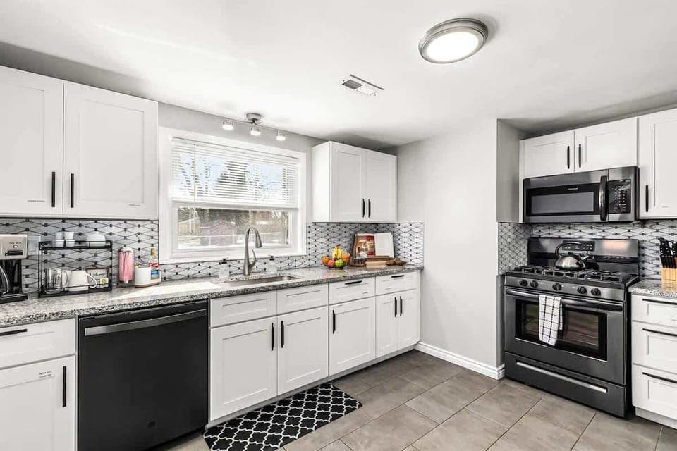 The fully equipped kitchen with granite countertops is ready for your MasterChef skills.