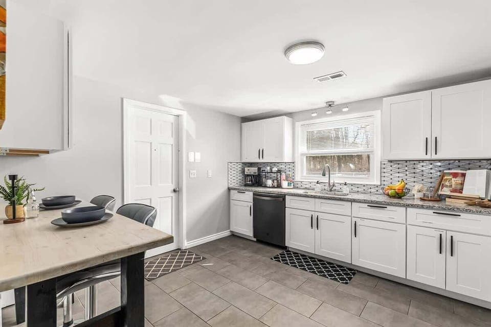 The fully equipped kitchen with granite countertops is ready for your MasterChef skills.