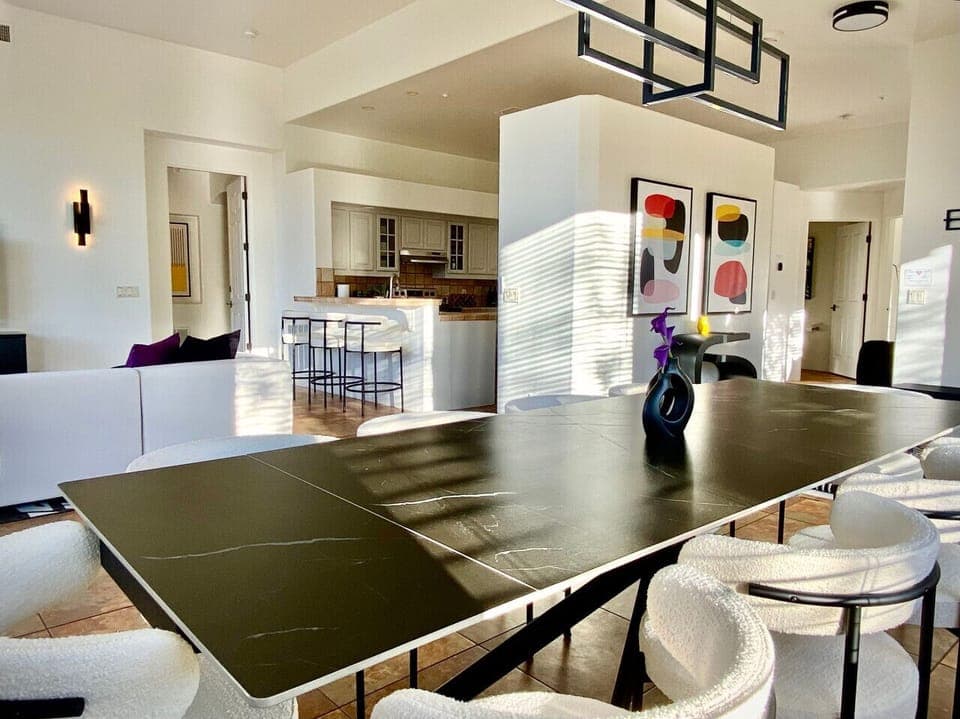 Expansive living and dining area with chef’s kitchen just steps away