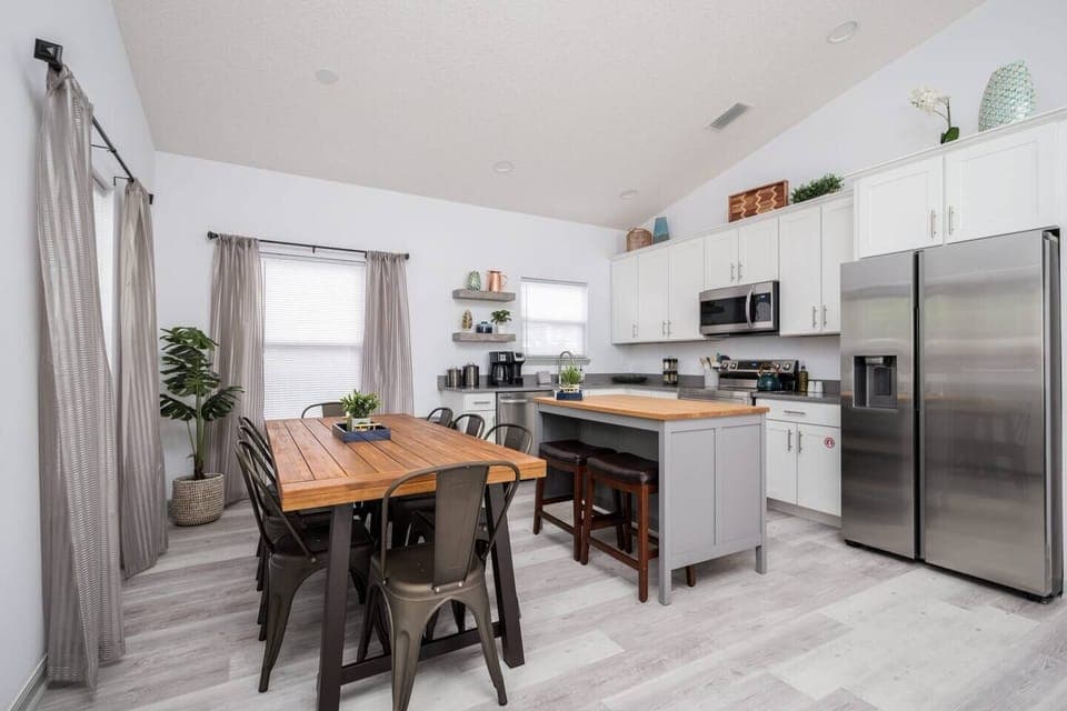 The dining table is an extension of the kitchen and comfortably seats 8 guests