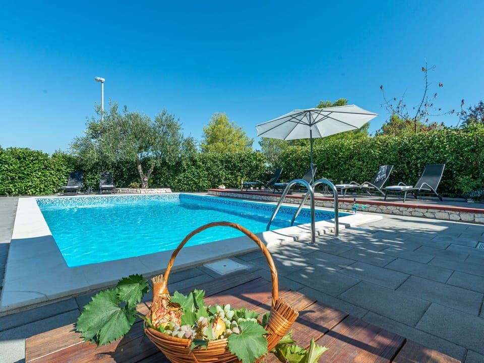 Water, Sky, Plant, Swimming Pool, Nature, Outdoor Furniture, Shade, Building, Sunlounger, Tree