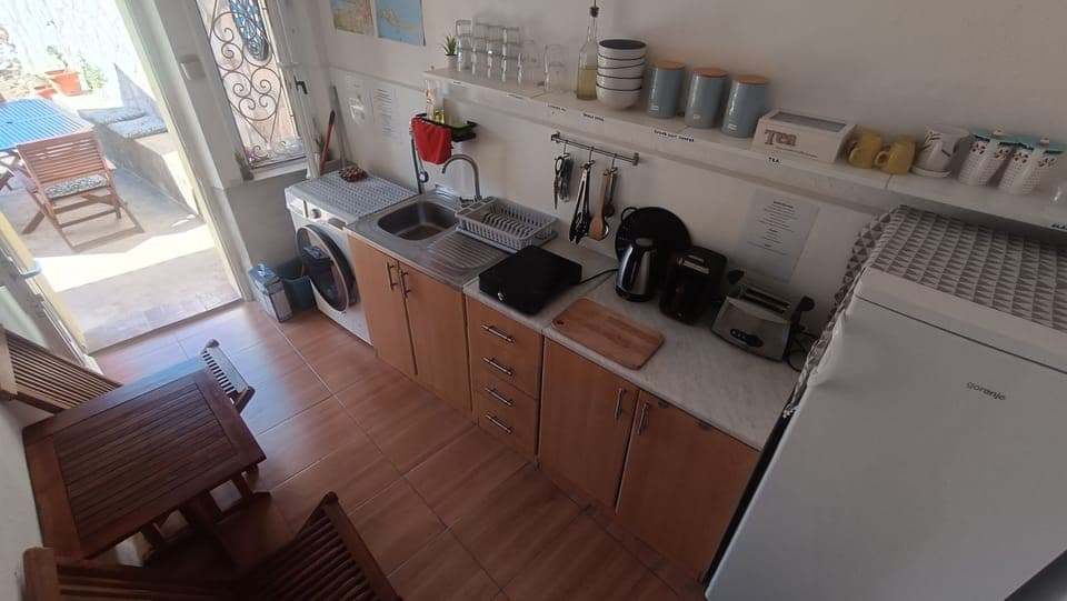 Kitchen ground floor, one table two chairs, no stove/ dish washer, fridge shared