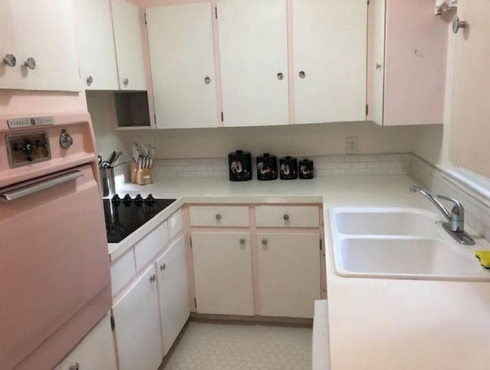 Vintage kitchen with original pink oven! New floor, counters and  sink.