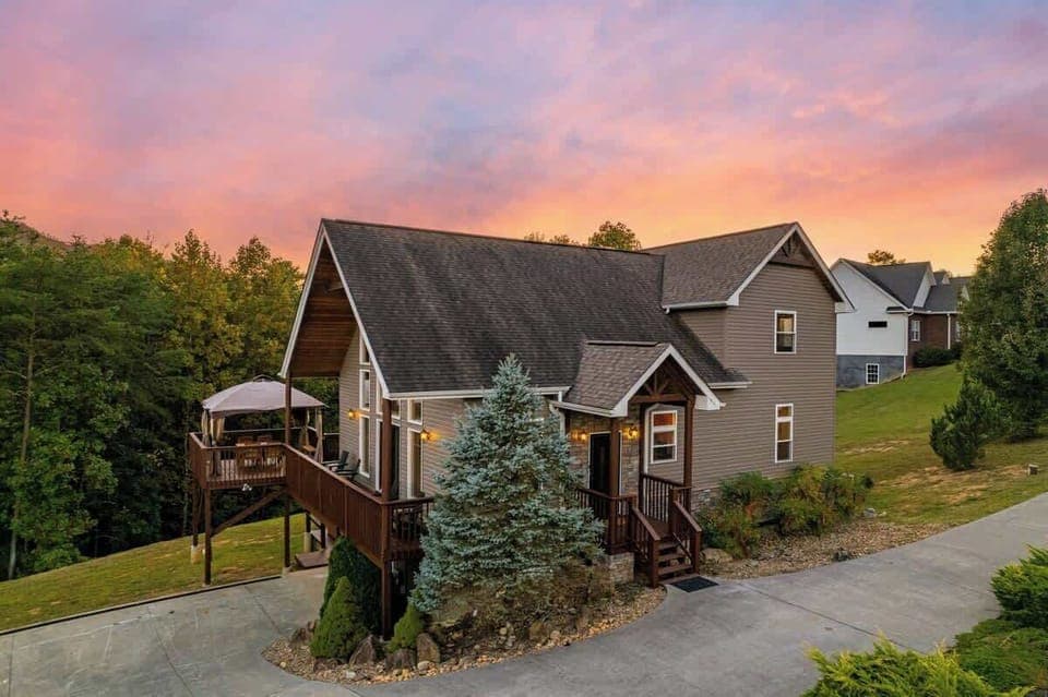 Enjoy stunning sunset views from the spacious deck of your mountain escape!