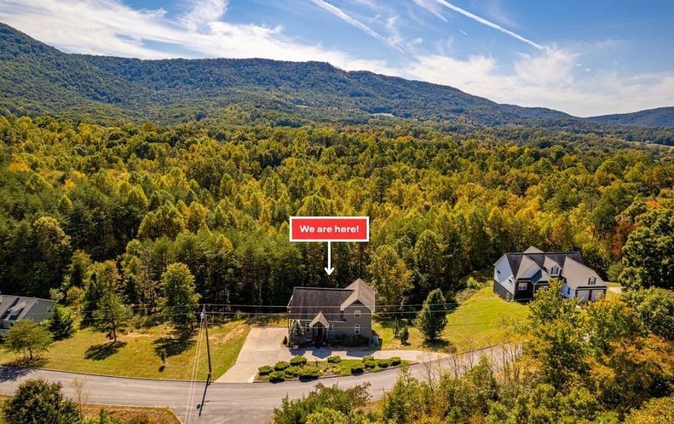 Stunning mountain views envelop this charming property in lush greenery!