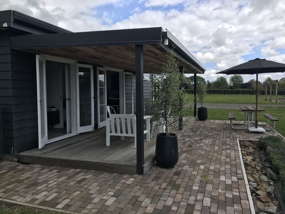 Deck area with open living from Kitchen area and lounge space