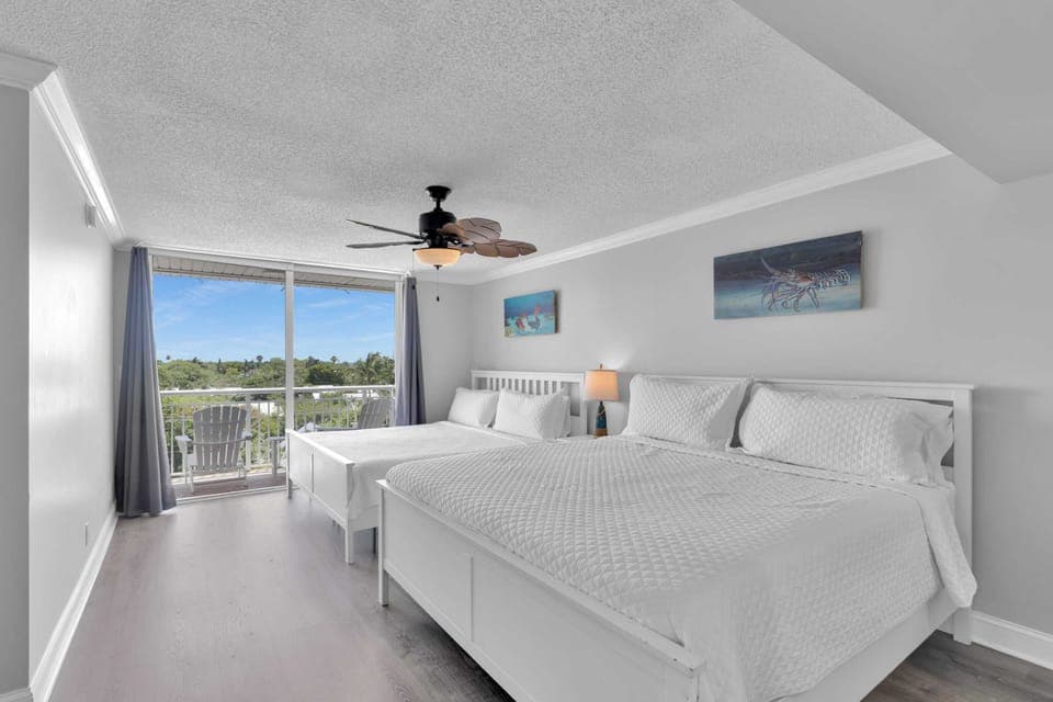 2nd floor two-King bedroom, access to balcony and en-suite bathroom