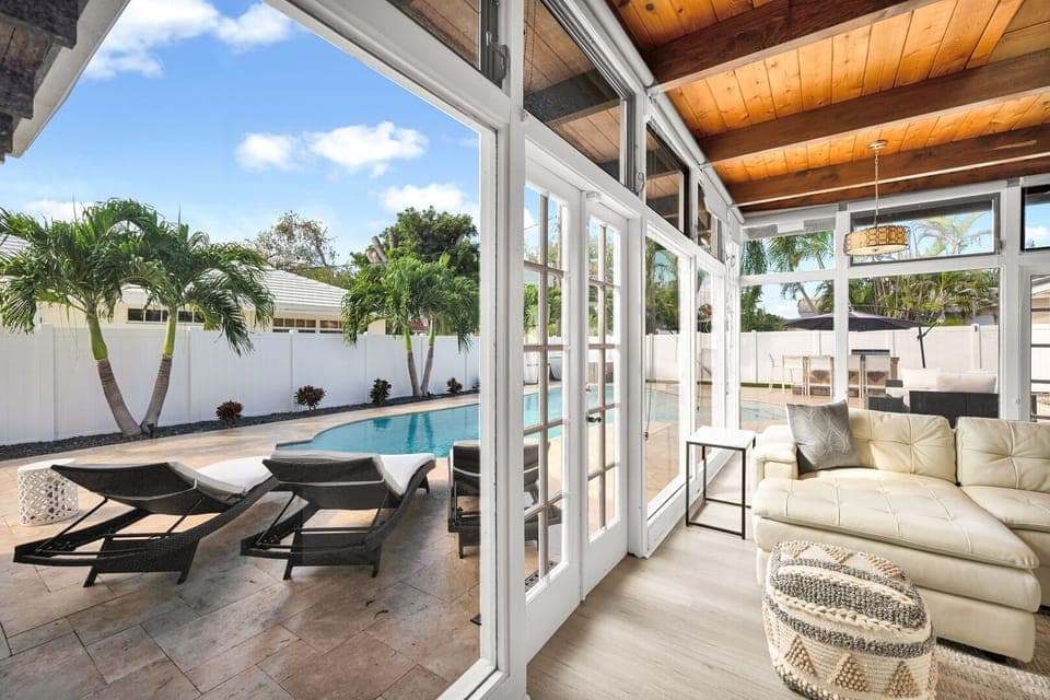 Floor to ceiling windows bring the interior and yard together in this bright, airy and open family home