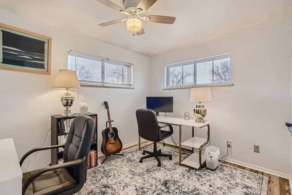 This office comes complete with two desks and two extra monitors for remote workers!